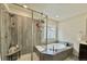 Modern bathroom with a walk-in shower and a built-in shelf at 14595 Vancouver Pl, Parker, CO 80134