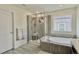 Spa-like bathroom featuring a large shower and a deep soaking tub at 14595 Vancouver Pl, Parker, CO 80134
