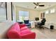 Bright office with a large desk, comfortable seating, and a view at 14595 Vancouver Pl, Parker, CO 80134