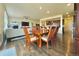 Dining area with hardwood floors and a large wooden table at 14595 Vancouver Pl, Parker, CO 80134