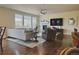 Spacious living room with hardwood floors, fireplace, and large windows at 14595 Vancouver Pl, Parker, CO 80134
