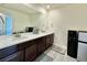 Bathroom with double vanity and large mirror at 14595 Vancouver Pl, Parker, CO 80134