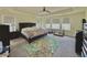 Main bedroom with large bed and plenty of light at 14595 Vancouver Pl, Parker, CO 80134