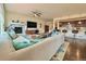 Open living room with fireplace and kitchen views at 14595 Vancouver Pl, Parker, CO 80134
