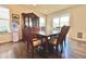 Bright dining room with hardwood floors and a china cabinet at 14595 Vancouver Pl, Parker, CO 80134