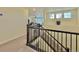 Upper level hallway with staircase and view into living area at 14595 Vancouver Pl, Parker, CO 80134