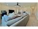 Bright bonus room featuring a sectional sofa and hallway at 14595 Vancouver Pl, Parker, CO 80134