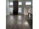 Living room with hardwood floors and a brick fireplace at 2604 S Dunkirk Ct, Aurora, CO 80013