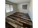 Bedroom with hardwood flooring and two windows at 2604 S Dunkirk Ct, Aurora, CO 80013