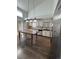 Kitchen with farmhouse-style cabinets and a large island at 2604 S Dunkirk Ct, Aurora, CO 80013
