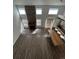 Open living area with a fireplace and kitchen view at 2604 S Dunkirk Ct, Aurora, CO 80013
