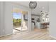 Dining area with sliding door to deck overlooking the backyard at 5675 Vivian St, Arvada, CO 80002