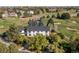 Luxury home nestled on a golf course, surrounded by trees at 1490 Saint Andrews Dr, Broomfield, CO 80020