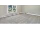 Simple bedroom with large window and neutral carpeting at 1490 Saint Andrews Dr, Broomfield, CO 80020