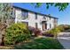 Two-story home with white brick exterior and manicured lawn at 1490 Saint Andrews Dr, Broomfield, CO 80020