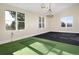 Indoor putting green and large windows in game room at 1490 Saint Andrews Dr, Broomfield, CO 80020