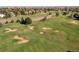 Aerial view of a golf course with sand traps and fairways at 1490 Saint Andrews Dr, Broomfield, CO 80020