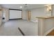 Finished basement home theater with projector screen and bar at 1490 Saint Andrews Dr, Broomfield, CO 80020