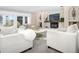 Relaxing living room with comfortable seating and a view of the backyard at 1490 Saint Andrews Dr, Broomfield, CO 80020