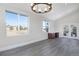 Bright office features hardwood floors, large windows, and built-in cabinetry at 1490 Saint Andrews Dr, Broomfield, CO 80020