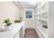 Modern pantry with white shelving and ample storage space at 1490 Saint Andrews Dr, Broomfield, CO 80020