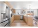 Modern kitchen with stainless steel appliances and light wood cabinets at 417 S Pontiac Way, Denver, CO 80210