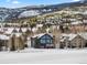 Luxury home nestled in a snow covered mountain community at 19 South Rd, Breckenridge, CO 80424