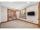 Bright bedroom featuring carpet floors and access to a patio at 19 South Rd, Breckenridge, CO 80424
