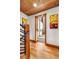 Upper hallway with wood floors and access to a luxurious bathroom at 19 South Rd, Breckenridge, CO 80424