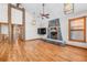 Spacious living room with hardwood floors and a stone fireplace at 19 South Rd, Breckenridge, CO 80424