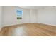 Bright and airy bedroom with hardwood floors and large window at 42980 Colonial Trl, Elizabeth, CO 80107