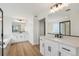 Modern bathroom with double vanity, soaking tub, and frameless glass shower at 42980 Colonial Trl, Elizabeth, CO 80107