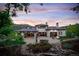 Luxury home with a backyard patio and a water feature at 11164 Beatrice Ct, Littleton, CO 80125