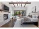 Spacious bedroom with fireplace and sliding glass doors leading to backyard at 11164 Beatrice Ct, Littleton, CO 80125