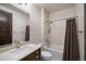 Clean bathroom with a shower/tub combo and modern vanity at 11164 Beatrice Ct, Littleton, CO 80125