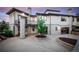 Home's backyard with stonework, landscaping, and a balcony at 11164 Beatrice Ct, Littleton, CO 80125