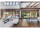 Open concept living and dining area with hardwood floors and access to the backyard at 11164 Beatrice Ct, Littleton, CO 80125