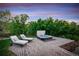 Hot tub with brick surround and lounge chairs on patio at 11164 Beatrice Ct, Littleton, CO 80125