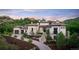 Luxury home with stone exterior, landscaping, and a large driveway at 11164 Beatrice Ct, Littleton, CO 80125