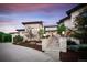 Elegant home exterior with stone accents and a landscaped entryway at 11164 Beatrice Ct, Littleton, CO 80125
