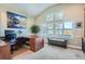 Home office with built-in desk and ample natural light at 8 Catamount Ln, Littleton, CO 80127