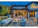 Cozy patio with pergola, seating area, and fire pit at 8 Catamount Ln, Littleton, CO 80127