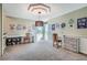 Home office with built-in shelving, a desk, and plenty of natural light at 8 Catamount Ln, Littleton, CO 80127