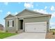 New single story home with neutral siding and two car garage at 2164 Alyssa St, Fort Lupton, CO 80621