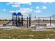 Community playground with playset and swings at 2164 Alyssa St, Fort Lupton, CO 80621