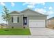 New single story home with neutral siding and two car garage at 2164 Alyssa St, Fort Lupton, CO 80621