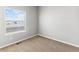 Simple bedroom with carpeted floor and window with blinds at 2164 Alyssa St, Fort Lupton, CO 80621