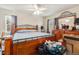 Large bedroom with a ceiling fan and wood-framed bed at 4545 Raritan St, Denver, CO 80211
