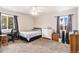Well-lit bedroom with a double bed and plenty of closet space at 4545 Raritan St, Denver, CO 80211