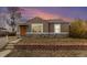 Charming ranch home with landscaped yard and brick accents at 4545 Raritan St, Denver, CO 80211